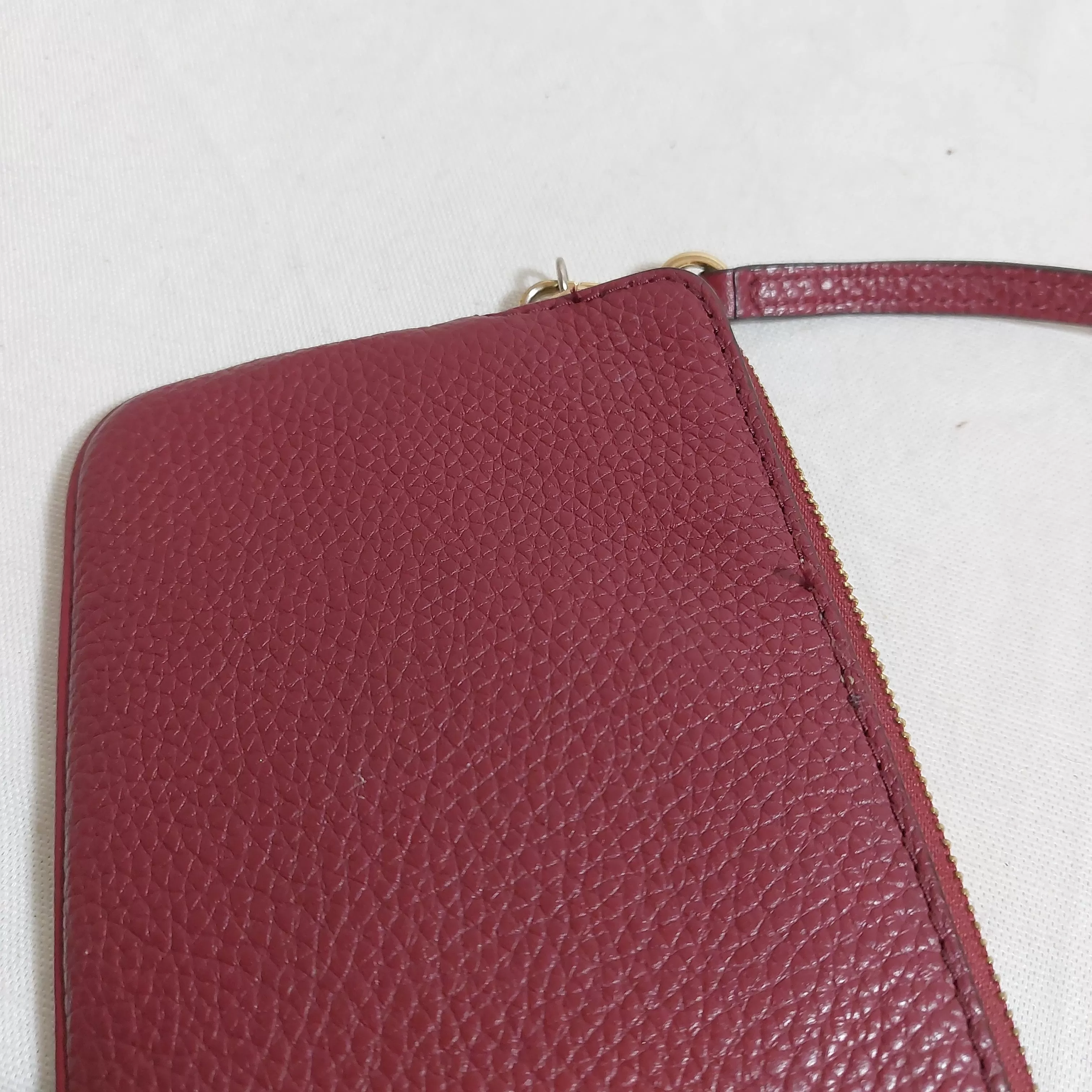 Michael Kors Maroon Pebbled Leather Wristlet | Pre Loved |