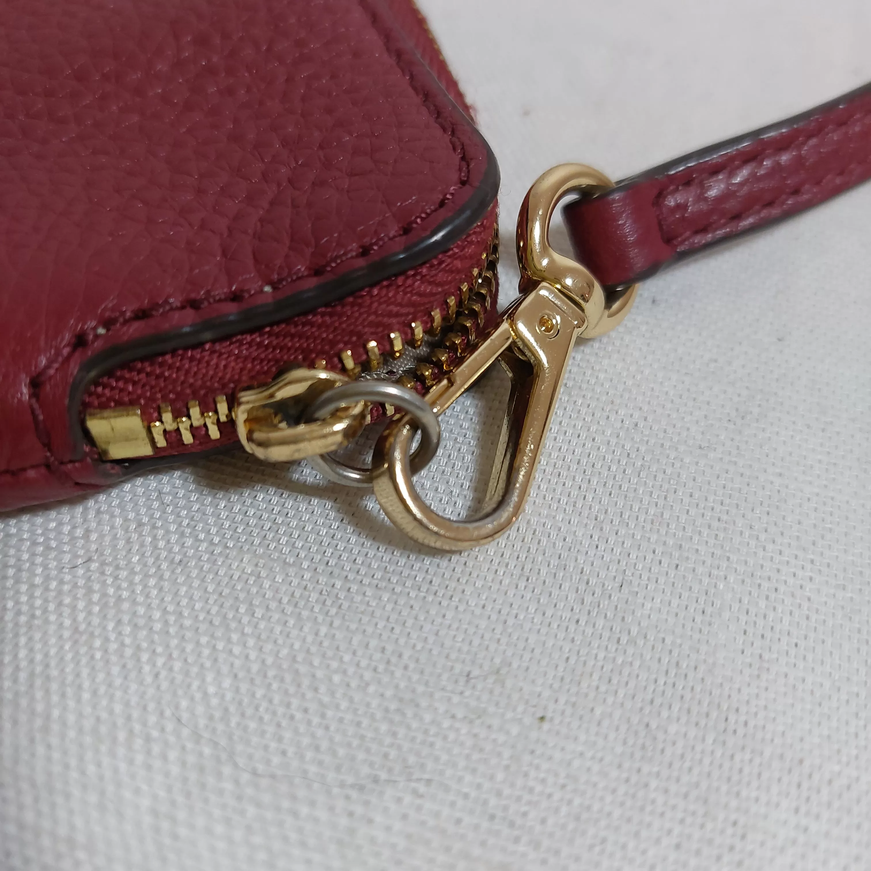 Michael Kors Maroon Pebbled Leather Wristlet | Pre Loved |