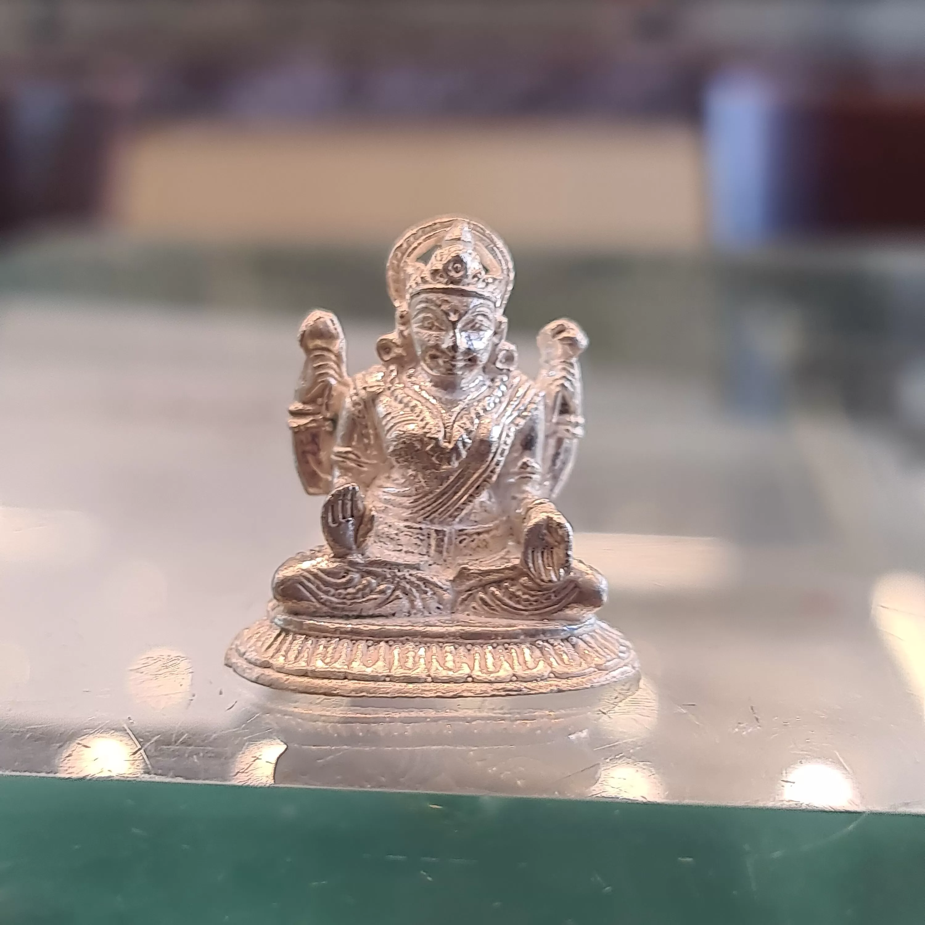 "Shining Symbol of Grace: The Silver Lakshmi Idol"